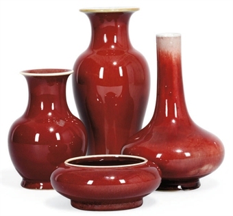 A GROUP OF THREE CHINESE SANG DE BOEUF VASES AND A BRUSHPOT