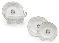 A Chinese monogrammed oval basket and stand; and two dishes, en suite
