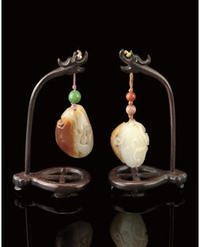 TWO RUSSET AND WHITE JADE PENDANTS