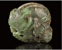 A SPINACH AND RUSSET JADE CARVING OF A CATFISH, 18TH CENTURY