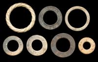 A GROUP OF SEVEN JADE RINGS，HAN DYNASTY (206 BC-AD 220) AND LATER