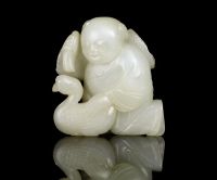 MING DYNASTY A PALE CELADON JADE CARVING OF A BOY AND GOOSE