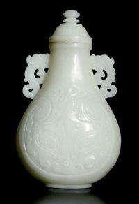 CIRCA 1900 AN OPAQUE WHITE GLASS VASE AND COVER