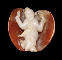 19TH CENTURY A CELADON AND RUSSET JADE FIGURAL CARVING