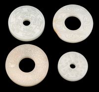 18TH CENTURY FOUR CELADON JADE BI-DISCS