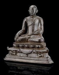 16TH CENTURY A BRONZE MODEL OF A MONK