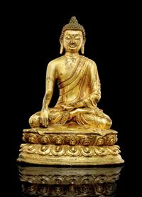 16TH/17TH CENTURY A TIBETAN GILT BRONZE MODEL OF SHAKYAMUNI