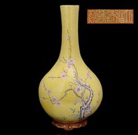 THE PERIOD 1736-1795 A YELLOW-GROUND FAMILLE ROSE WALL VASE