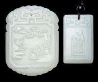 20TH CENTURY TWO CELADON JADE PENDANTS